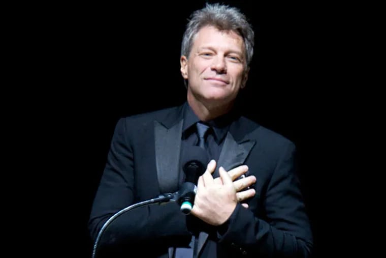 Jon Bon Jovi places his hands over his heart after receiving the Marian Anderson Award on Nov. 18, 2014. ( CHARLES FOX / Staff Photographer )