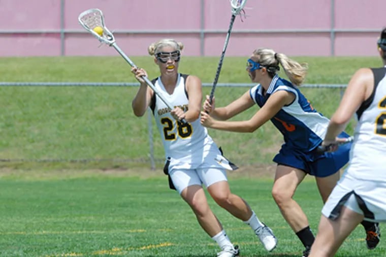 Alyssa Ogle helped lead Moorestown to its 10th straight Tournament of Champions crown in lacrosse. She also excelled in soccer and basketball. (Bob WIlliams / For the Inquirer)