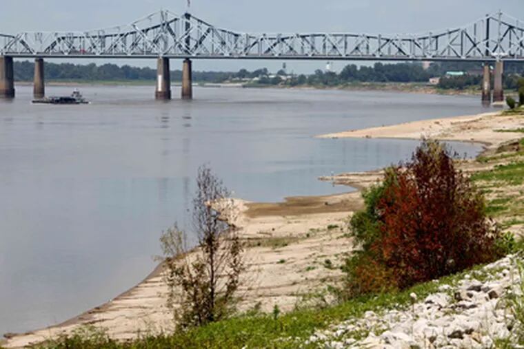 The bank of the Mississippi River near Vicksburg, Miss., erodes as the 2012 drought deepens. After months of drought, there are fears the river could become impassable to barges. ROBERT RAY / Associated Press