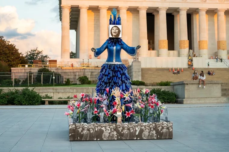 "Of Thee We Sing," a sculpture by vanessa german, depicts Philadelphia-raised opera star Marian Anderson, referencing her legendary 1939 performance at the Lincoln Memorial. It is one of six artworks on the National Mall in Washington, part of the exhibit "Beyond Granite: Pulling Together," curated by Monument Lab, running through Sept. 18.