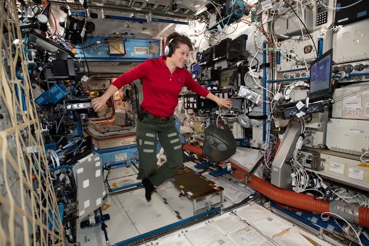 In this Jan. 18, 2019 photo made available by NASA, Flight Engineer Anne McClain looks at a laptop computer screen inside the U.S. Destiny laboratory module of the International Space Station. McClain was supposed to participate in a spacewalk Friday, March 29, 2019 with newly arrived Christina Koch. But McClain pulled herself from the lineup because there’s not enough time to get two mediums suits ready. Koch will go out with a male crewmate.