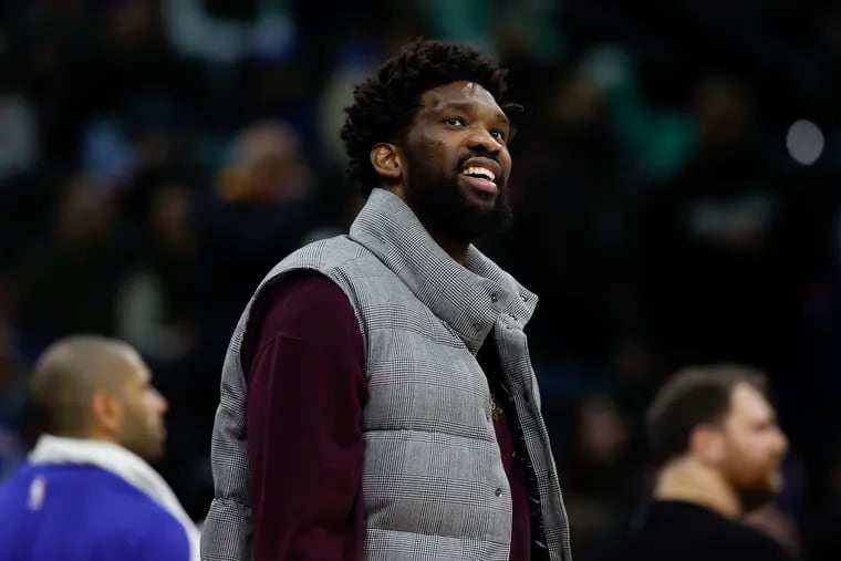 Sixers center Joel Embiid smiles while his teammates played the Sacramento Kings on Friday, January 12, 2024 in Philadelphia.