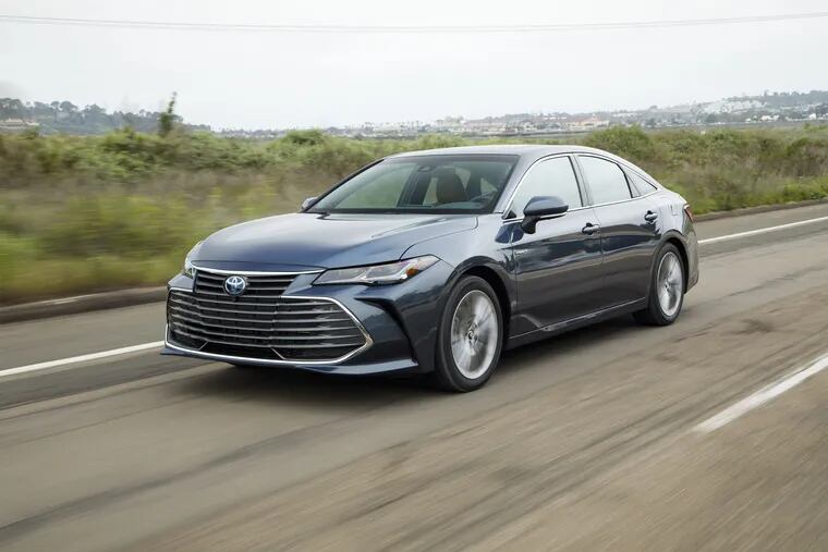 The Toyota Avalon gets a new look for 2019 — lower and wider, but not exactly handsomer. Maybe just a little scowlier. Fuel economy from the hybrid is vastly improved.