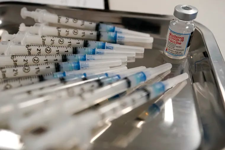 This March 18 photo shows syringes filled with the Moderna COVID-19 vaccine at a pop-up site in the Queens borough of New York.