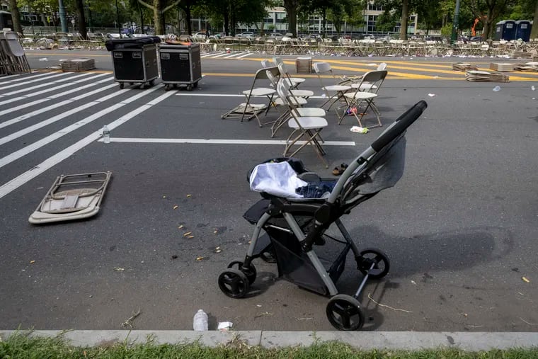 A baby stroller was left on the Benjamin Franklin Parkway after the area was cleared when shooting erupted during Monday night's fireworks display. Two police officers were injured by gun fire during the 4th of July celebration and fireworks on Parkway. Photo taken on Tuesday morning July 5, 2022.
