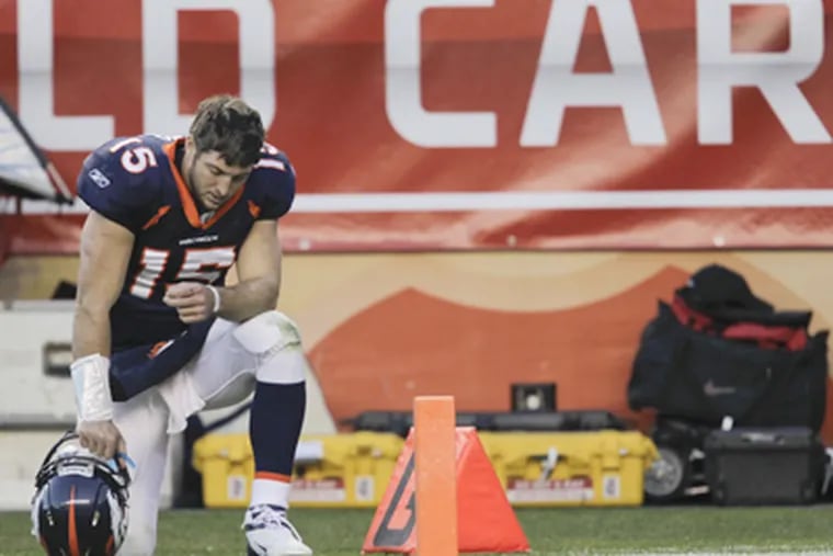 Denver Broncos quarterback Tim Tebow has drawn attention for his gesture of dropping to one knee, bowing his head, and praying. (Joe Mahoney / Associated Press)
