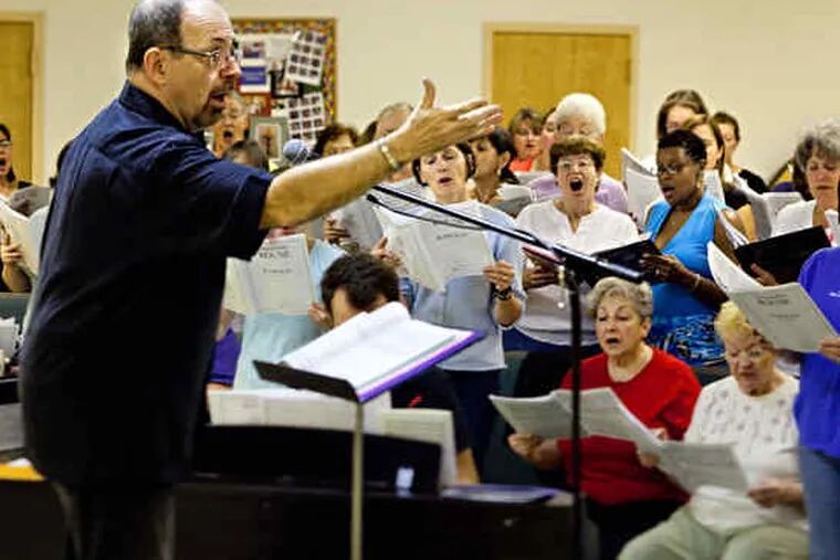 The Greater South Jersey Chorus' artistic director, Dean Rishel, leads one of the weekly rehearsals at the Unitarian Universalist Church in Cherry Hill.&quot;Being here is a joy, but we do have jobs - some more than one job - and houses and kids, too,&quot; says member Santina Smith of Mount Laurel.