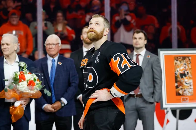 Flyers center Claude Giroux looks-up during a ceremony before playing his 1000th game as a Flyers' on Thursday, March 17, 2022 in Philadelphia.