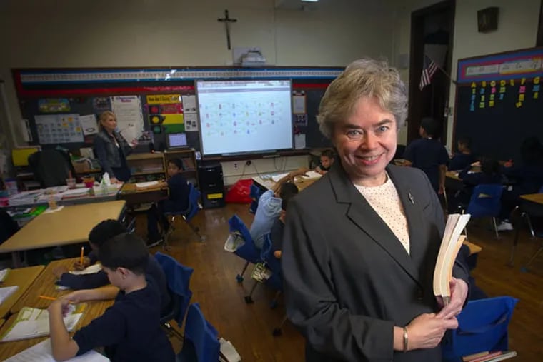 Sister Karen Dietrich, executive director of Catholic Partnership Schools, stands in the third-grade class of Shannon Jeres on Friday, April 17, 2015, in Camden. ( ALEJANDRO A. ALVAREZ / Staff Photographer )