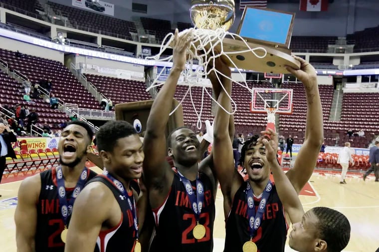 IMHOTEP players celebrate after winning the Bonner-Prendergast vs. IMHOTEP H.S.PIAA Class 4A boys basketball championship at the Giant Center in Hershey, Pa. on March 21, 2019.