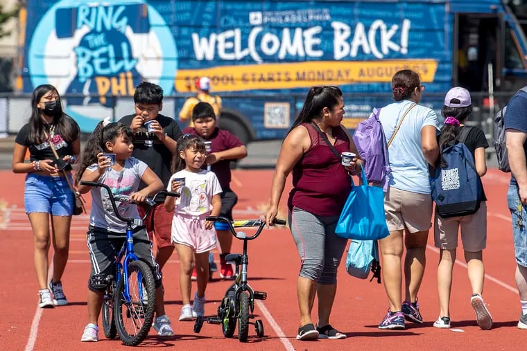 Families attend Philly's back-to-school tour on South Philadelphia High's football field.