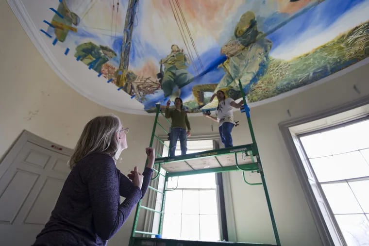 Painter Jane Irish, directing the installation of “Antipodes” at Lemon Hill mansion in Fairmount Park.