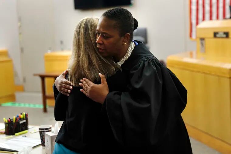 Judge Tammy Kemp gives Amber Guyger a hug before she leaves for jail last week.