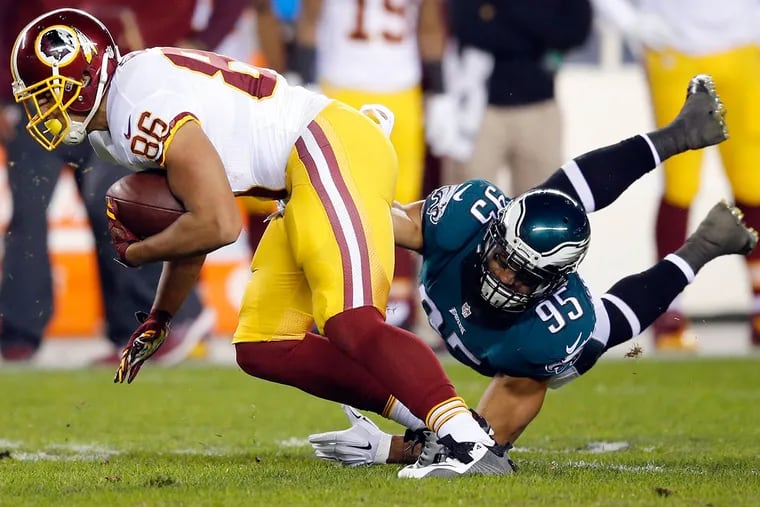 Eagles' Mychal Kendricks tries to stop Washington Redskins' Jordan Reed in the first quarter.