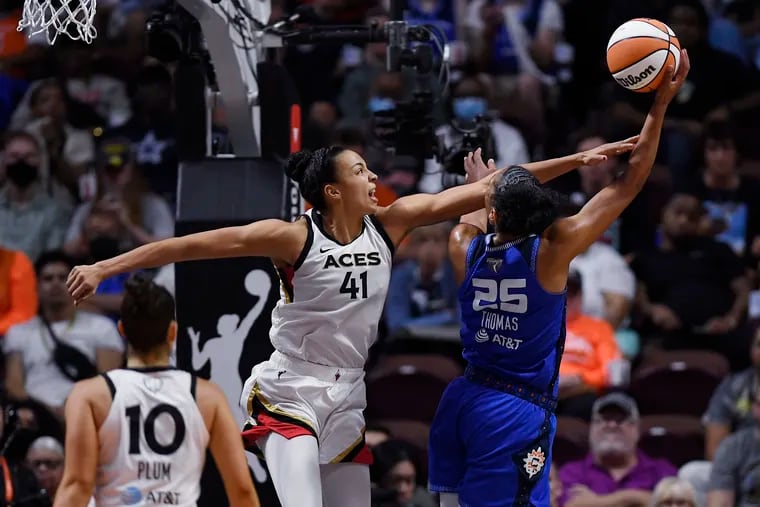 Connecticut Sun's Alyssa Thomas, of Harrisburg, shoots as Las Vegas Aces' Kiah Stokes (41) defends during the second half in Game 3 of the WNBA Finals on Thursday. Stokes' father, Greg, played for the 76ers.