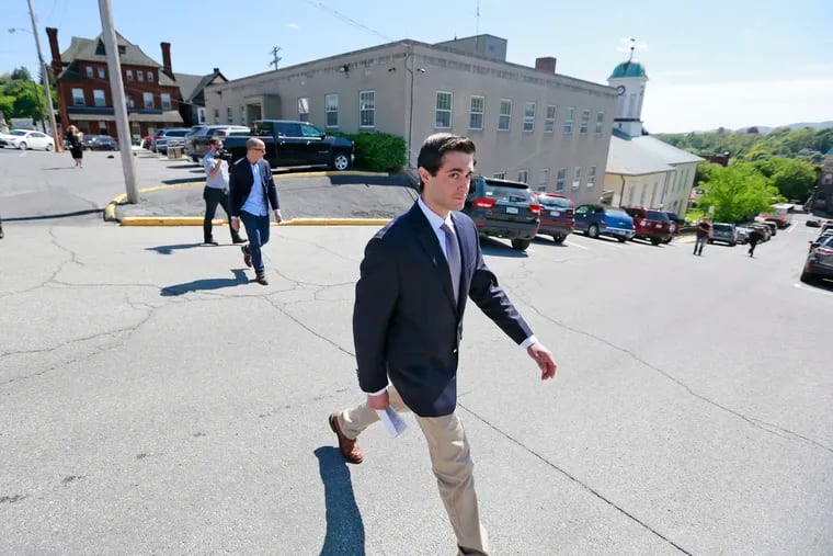 FILE - Braxton Becker walks as eight more Penn State Beta Theta Pi brothers are arraigned at Centre County Courthouse in in Bellefonte, Pa., Tuesday, May 9, 2019. ( DAVID SWANSON / Staff Photographer )