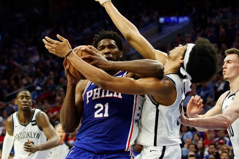 Trying to drive toward the basket, Joel Embiid's elbow hits Brooklyn center Jarrett Allen in the face during the first half of the Sixers' 145-123 win in Game 2 on Monday. Embiid was called for a flagrant-1 foul on the play.