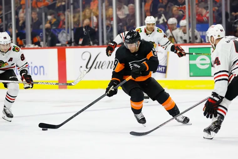 Flyers right wing Cam Atkinson skates with the puck against the Chicago Blackhawks on Saturday.