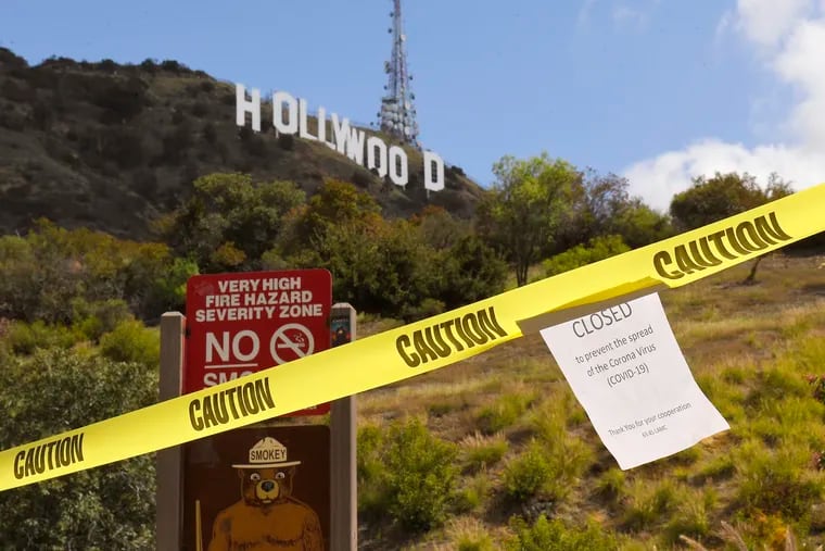 Los Angeles officials sealed off the entrance to the Innsdale Trail, near the famous Hollywood sign, in order to encourage people to stay home.