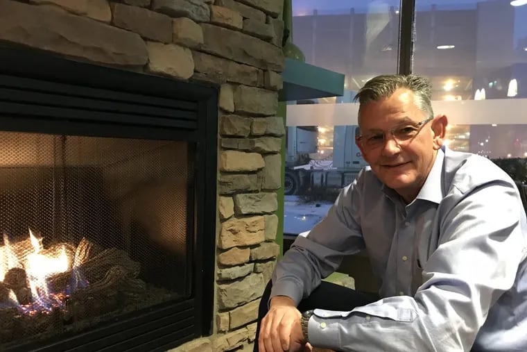 Philadelphia native Mark Turner, shown here in the cafe' on the first floor of his Wilmington headquarters tower, is chief executive of WSFS, the biggest bank still based in the Philadelphia Federal Reserve District. Turner says more than half its new loans are to customers in Pennsylvania, where he's planning more offices.