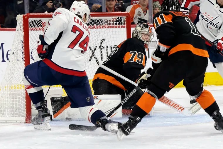 Flyers goalie Carter Hart makes a save on a shot by John Carlson in the second period Wednesday.