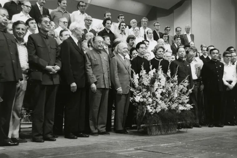 Conductor Eugene Ormandy (first row, center) stands beside Madame Mao during a historic visit by Philadelphia Orchestra to Beijing in 1973, the first appearance by any U.S. orchestra in communist China.