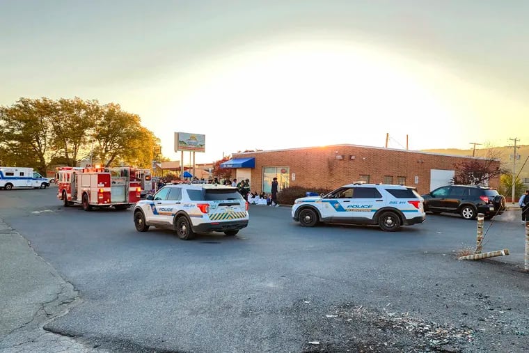 Emergency responders work on the scene of an apparent carbon monoxide leak at a day care center in Allentown, Pa. on Tuesday, Oct. 11, 2022. (Zach DeWever/WFMZ-TV via AP)