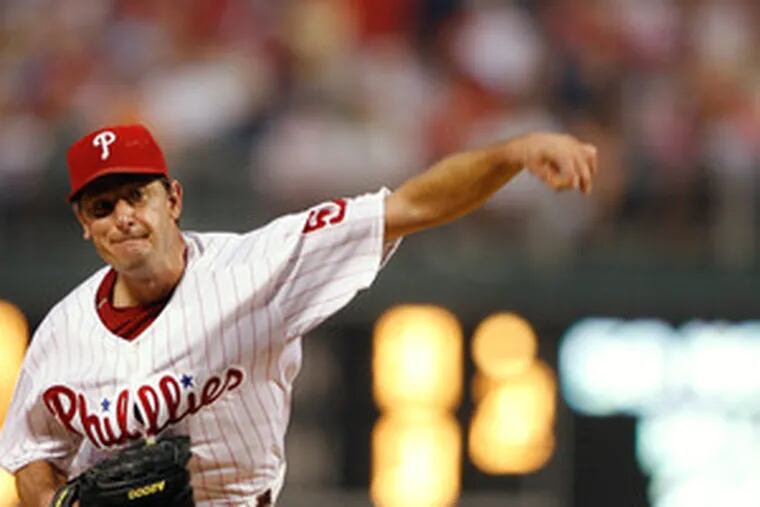 Lefthander Jamie Moyer delivers a pitch against the Reds. He took a no-hitter into the sixth and had a 3-0 lead in the seventh. But he ran into trouble, and the bullpen failed to come through.
