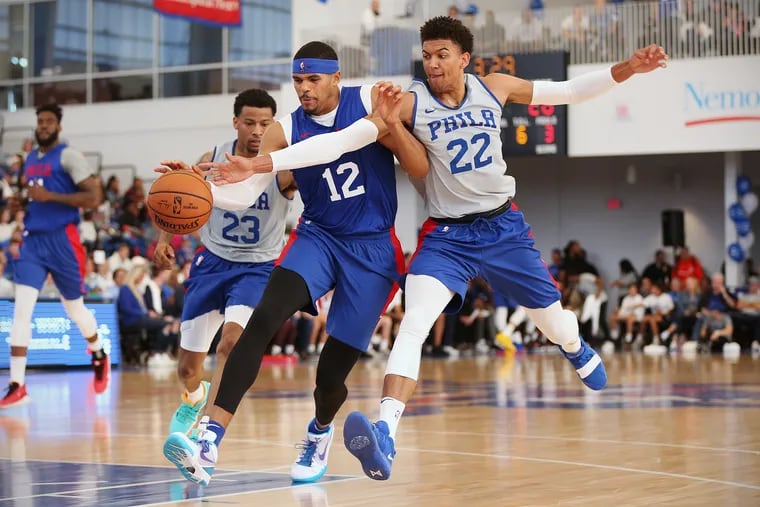 Sixers guard Matisse Thybulle (22) tries to knock the ball away from forward Tobias Harris (12) during the Sixers' annual Blue and White Scrimmage at the 76ers Fieldhouse in Wilmington, Del., on Saturday, Oct. 5, 2019.