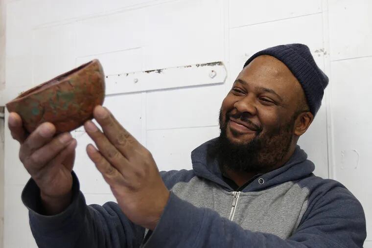 Byron Walker-Bey works on a piece at The Clay Studio in Philadelphia, Pa. on January 14, 2015.  ( DAVID MAIALETTI / Staff Photographer )