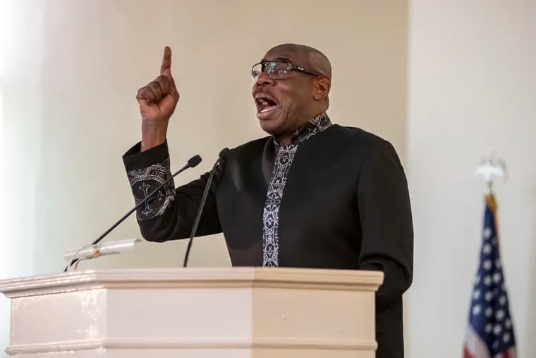 The Rev. Herb Lusk, pastor at the Greater Exodus Baptist Church, in a file photo last Easter. In a sermon on Father's Day, he decried the city's record-pace gun violence, which continued this weekend, including the shooting of a 3-year-old boy.