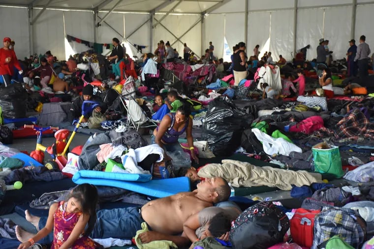Central American migrants rest and feed before leaving to continue on their way to Queretaro in order to reach the U.S. border, at Jesus Martínez Stadium on November 9, 2018, in Mexico City.