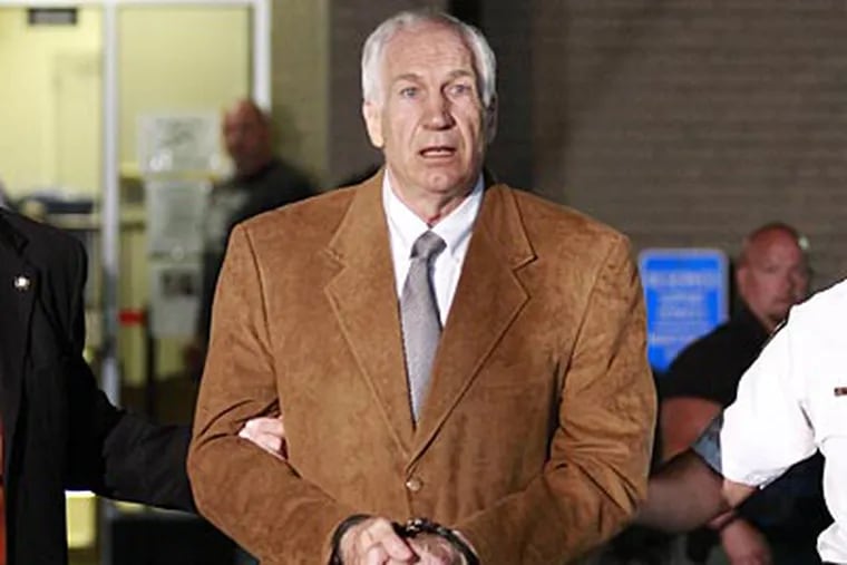 Jerry Sandusky leaves the Centre County Courthouse after being found guilty of child sex abuse. (David Swanson/Staff Photographer)