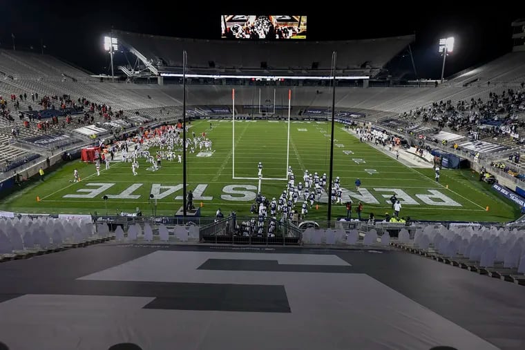 Penn State and Ohio State players taking the field Saturday night.