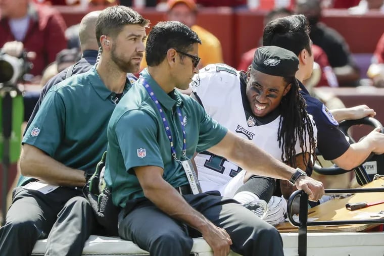 Eagles cornerback Ronald Darby gets carted off the field during the second quarter against the Redskins on Sept. 10.