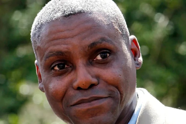After being deemed ineligible to run for the N.J. Senate by Lt. Gov. Kim Guadagno, a federal appeals court decision puts Olympic gold medalist Carl Lewis back on the ballot. (Julio Cortez/AP photo)