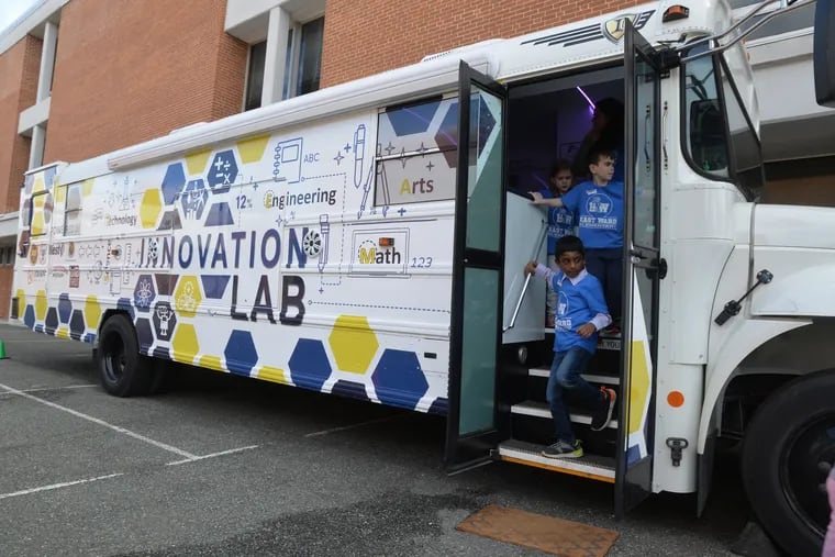 First grade students depart the Mobile Innovation Lab, a converted school bus, at East Ward Elementary School in  Downingtown.