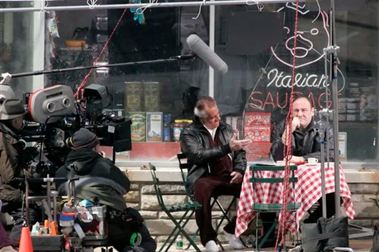 FILE - Actors Tony Sirico, left, who plays Paulie Walnuts and James Gandolfini, right, who plays Tony Soprano, shoot a scene from the mafia drama, "The Sopranos," outside the fictional Satriale's pork store in Kearny, N.J., in this Wednesday, March 21, 2007 file photo. (Editor's note: A different photo ran with this story when it was originally published on June 11, 2007.)