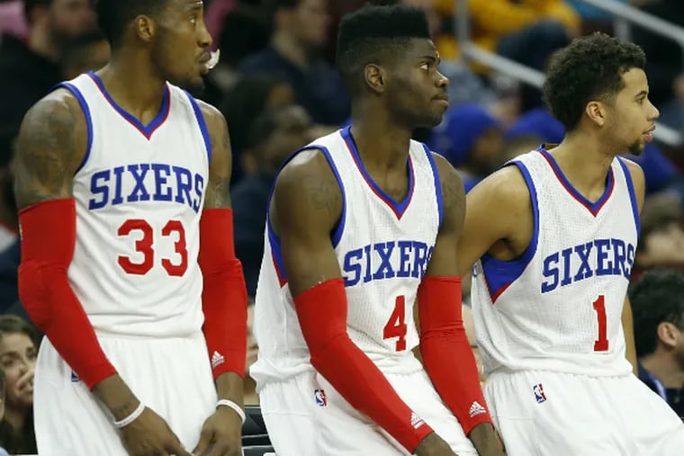 Robert Covington (left), Nerlens Noel (center) and Michael Carter-Williams are among the Sixers’ young core players.