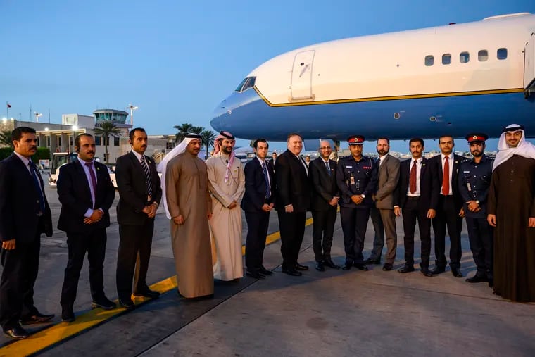 U.S. Secretary of State Mike Pompeo, center, poses with his local security team before departing Manama International Airport in Manama, Bahrain, Friday, Jan. 11, 2019. (Andrew Caballero-Reynolds/Pool Photo via AP)