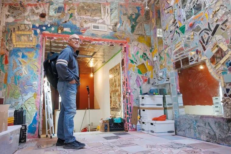 Ken Silver of Jim’s Steaks in a room filled with glittery mosaics mainly by Philadelphia artist Isaiah Zagar. An expansion exposed previously hidden work by Zagar.