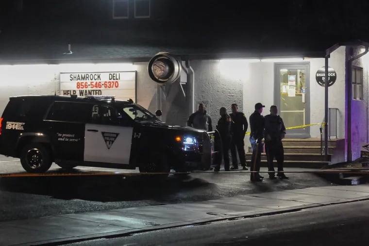 Police officers at  the Shamrock Deli in Audubon Friday evening shortly after owner Jerome Pastore was stabbed to death.