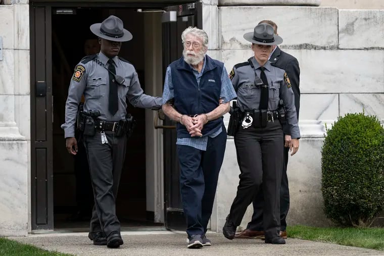 David Zandstra is escorted out of the Delaware County Courthouse by Pennsylvania State Police on Thursday. Zandstra, 83, has been charged in the abduction and murder of eight year-old Gretchen Harrington in 1975.