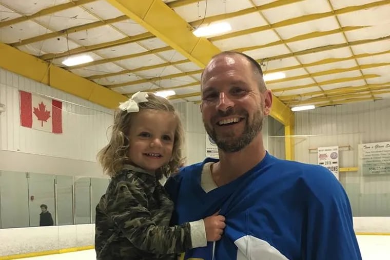 Gerard Grandzol with his daughter Violet, 2, at the August 2017 Checking For Charity ice hockey tournament in Voorhees, N.J.