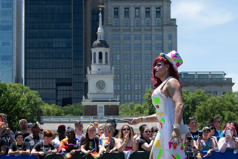 A participant dressed in drag marches down Market Street during the 31st annual Philly Pride Parade.