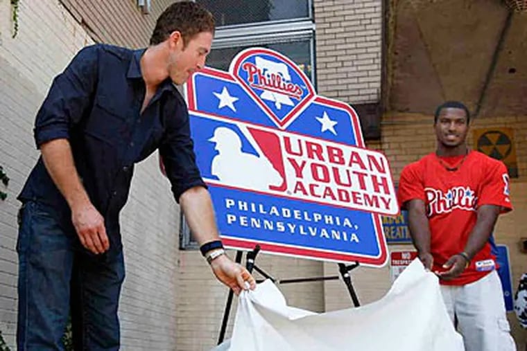 Chase Utley (left) and Penn Charter's Demetrius Jennings at the unveiling in September. (David Maialetti/Staff file photo)