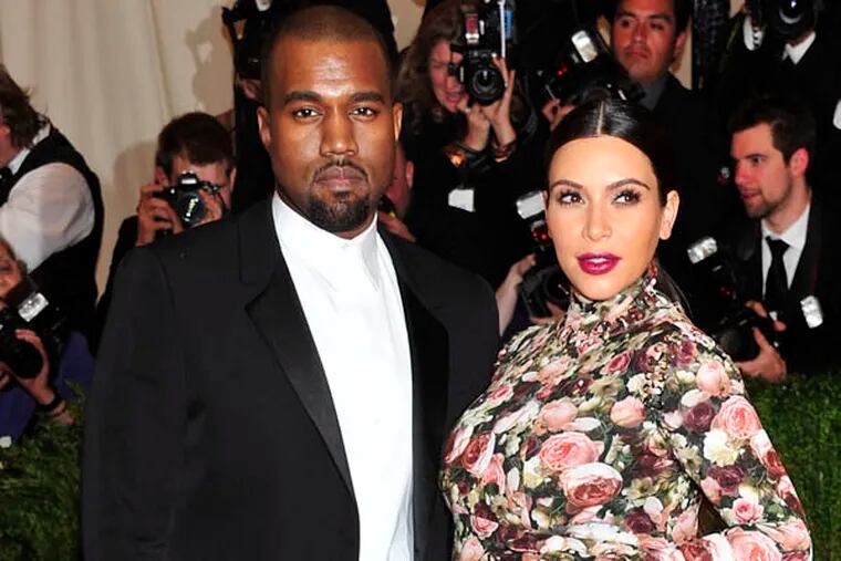 FILE - This May 6, 2013 file photo shows rapper Kanye West and Kim Kardashian attending The Metropolitan Museum of Art's Costume Institute benefit celebrating "PUNK: Chaos to Couture" in New York. A birth certificate released by the Los Angeles County Dept. of Public Health shows that the couple's daughter North west, was born on Saturday, June 15, 2013 at Cedars-Sinai Medical Center in Los Angeles. (Photo by Charles Sykes/Invision/AP, file)