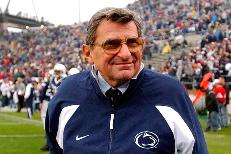 Penn State coach Joe Paterno walks the field before a 2004 game against Michigan State in State College, Pa. Paterno died in 2012.