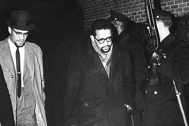 Walking through a row of Philadelphia Police there to protect him, Malcolm X arrived at WDAS studios on the night of Dec. 29, 1964, for one of his last interviews. (UPI TELEPHOTO WIRE SERVICE - WDASHISTORY.ORG)