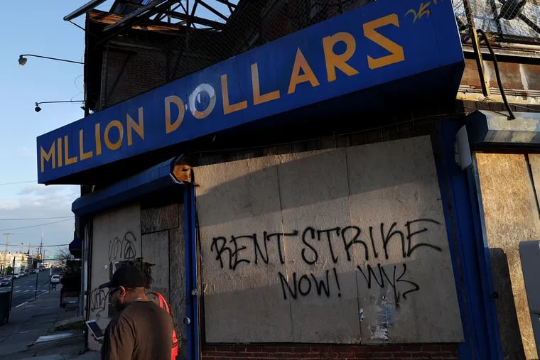 Early in the pandemic, some renters called for a rent strike, a sentiment seen in graffiti pictured on a corner store in West Philadelphia in April 2020. The city is distributing tens of millions of dollars in rental assistance to keep people in their homes, but it's not enough.